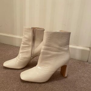 White faux leather snake print heeled boots